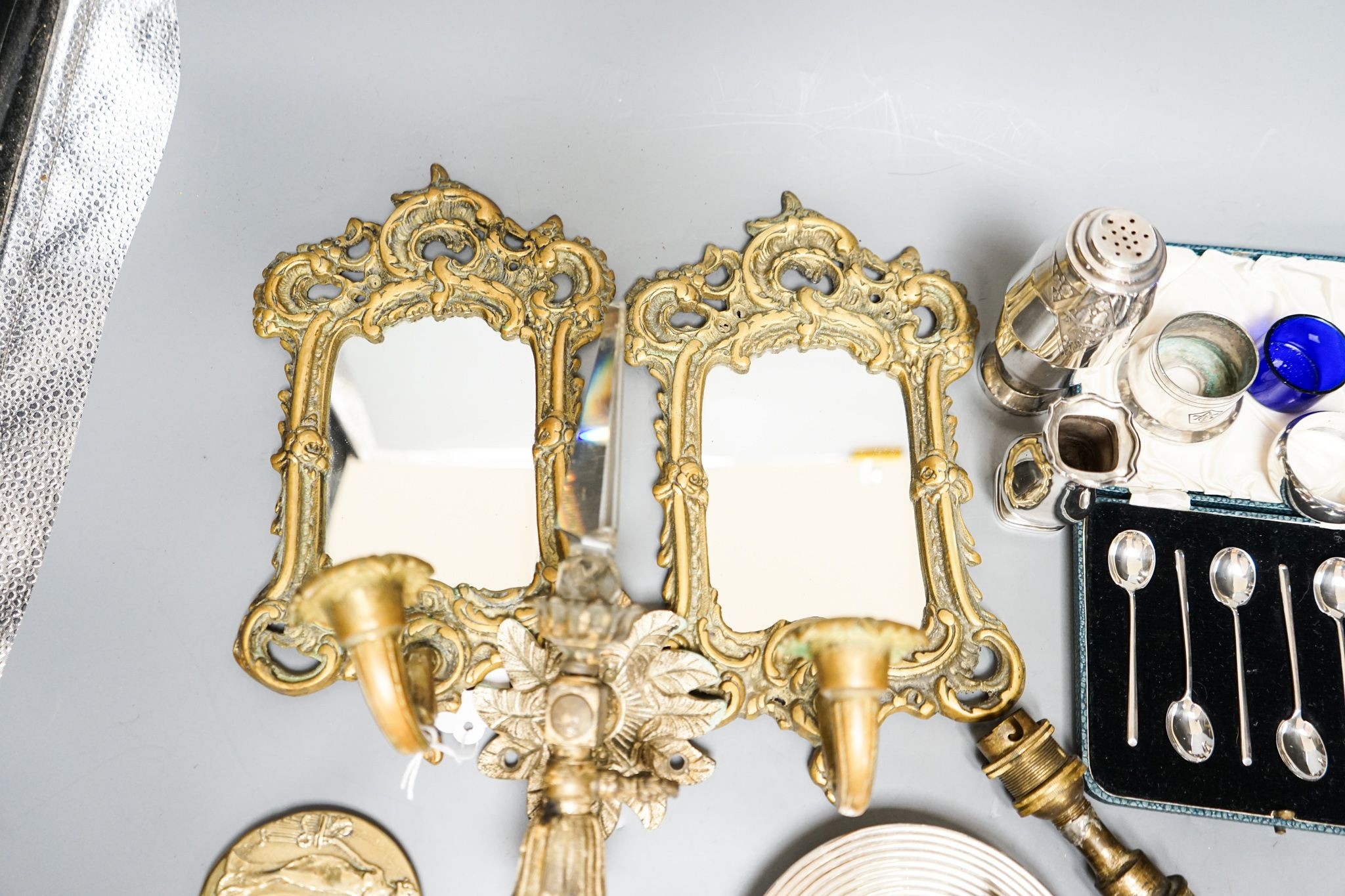 A pair of silver cruets and boxed spoons, various plate and a pair of wall mirrors and a glass wall light